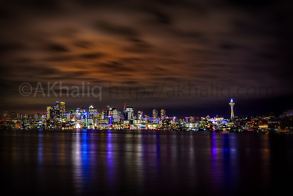Seattle skyline, with cranes and their holiday lights.